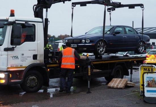 Photograph of Removal of Untaxed Vehicles Underway