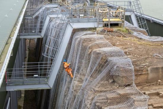 Photograph of Rope Access Experts Carry Out Rock Maintenance Work At Dounreay Waste Vaults