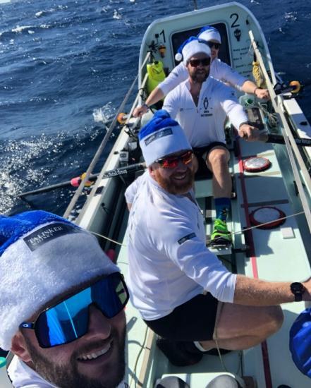 Photograph of 107 Rowers Celebrate Christmas Day In The Atlantic