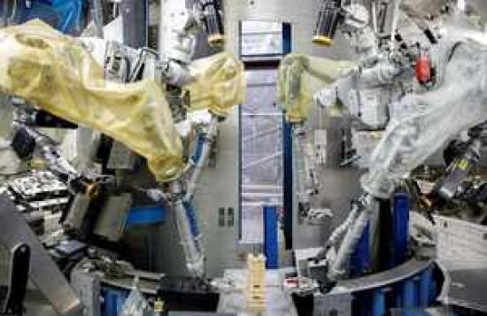 Photograph of Robotic Superhero Meets Identical Twin In Fusion Energy Machine