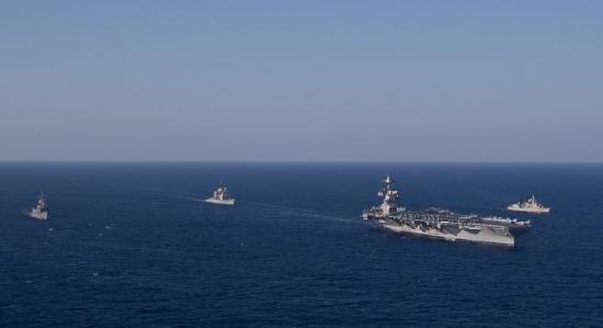 Photograph of NATO Ships Train Alongside World's Largest Warship, The USS Gerald R. Ford