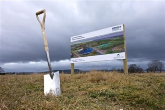 Photograph of Finance Minister Cuts Turf For New Inverness Campus