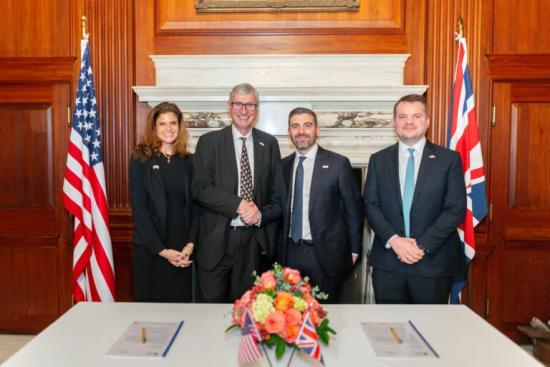 Photograph of UK and US nuclear experts sign landmark partnership